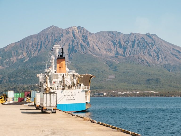 Cargo ship and port representing Asia-Pacific trade routes