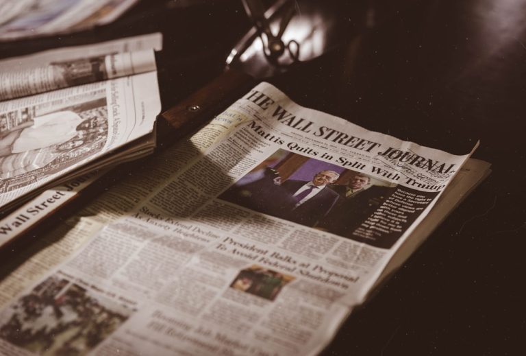 Newspaper on a desk representing editorial reasoning and transparency