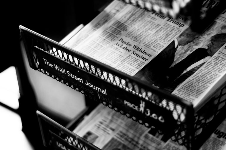 Newsstand representing public debate, fact and forecast