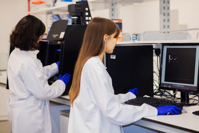 Scientists working with computers and research data in a laboratory