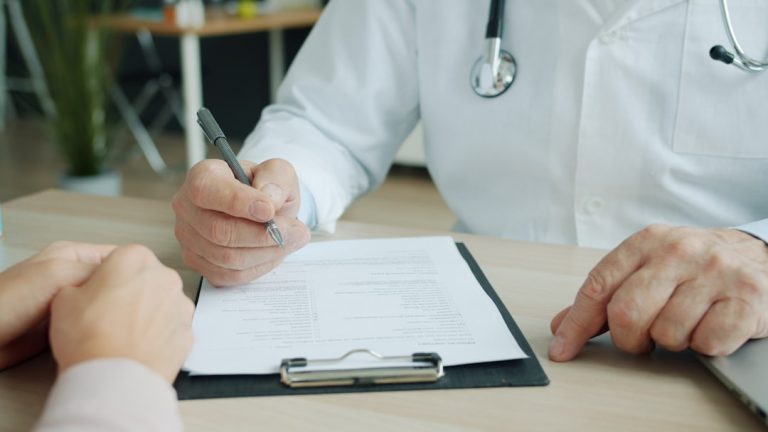 Doctor consultation representing prevention and early detection